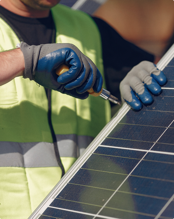 male-worker-blue-uniform-outdoors-with-solar-batteries-sunny-day